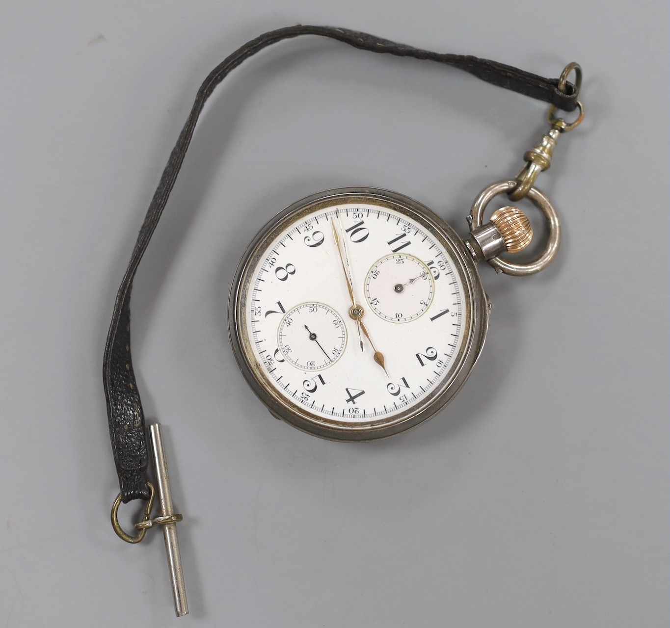 A lady's 9ct gold Omega manual wind wrist watch, a 935 white metal fob watch with albert and a silver open faced pocket watch.
